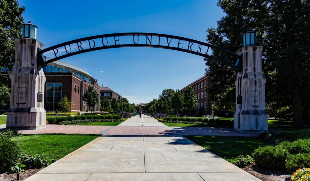 Scenic view of Purdue University's entrance arch with a clear blue sky.